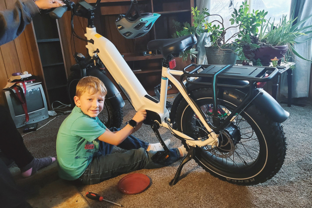 A happy child with an ebike